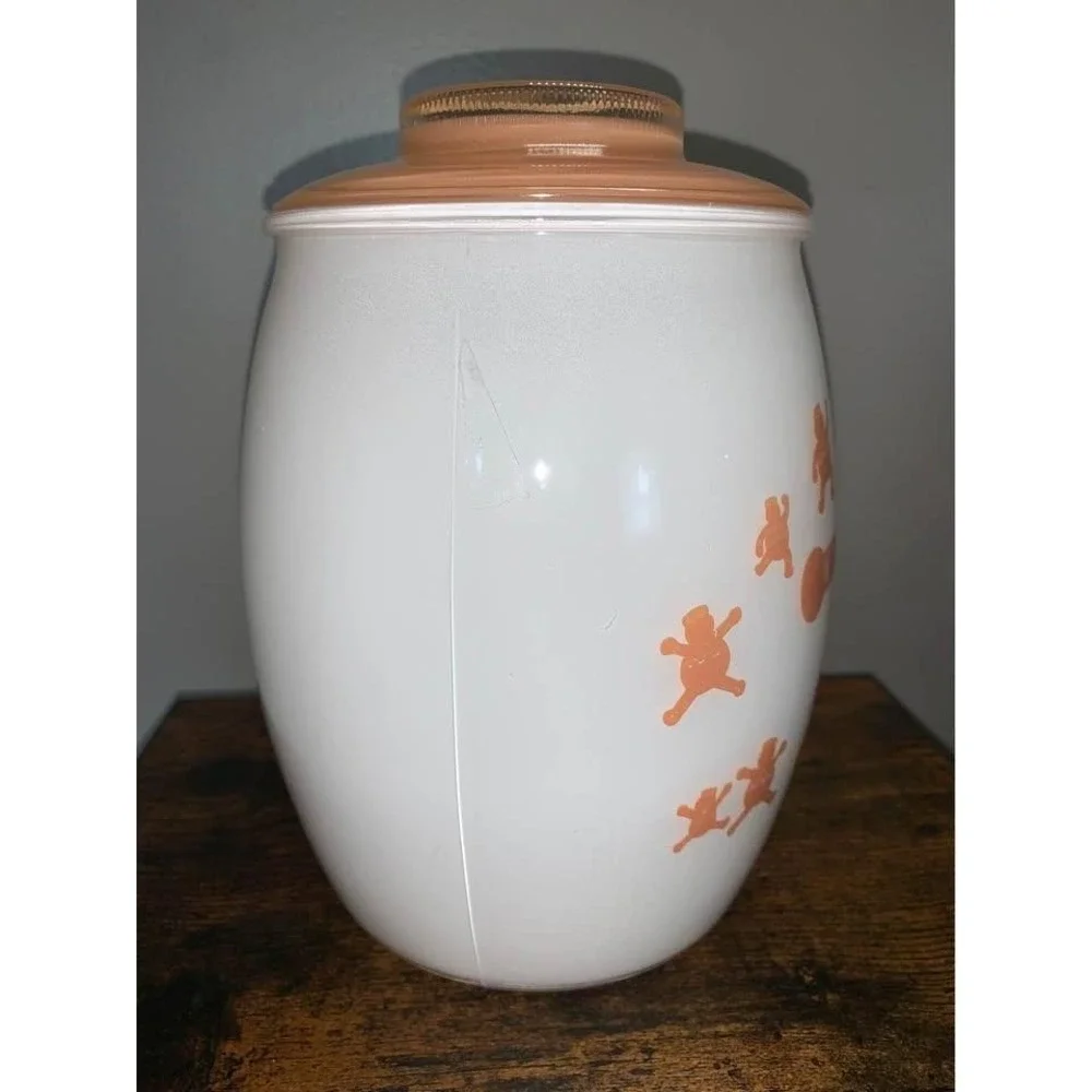 Vintage Bartlett Collins milk glass cookie jar featuring gingerbread man design